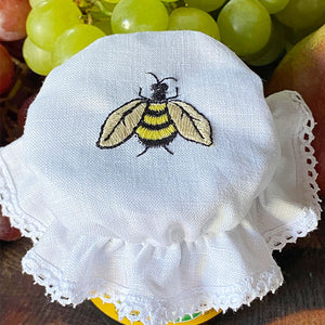 Bee glass lid embroidered with lace