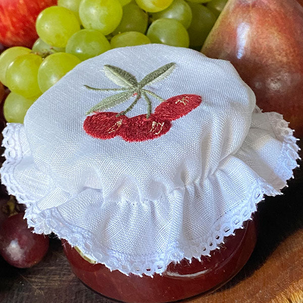Cherry glass lid embroidered with lace
