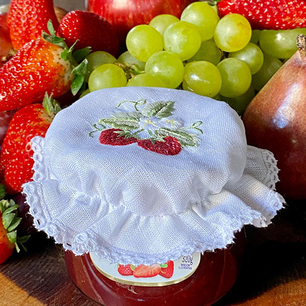 Strawberry glass lid embroidered with lace